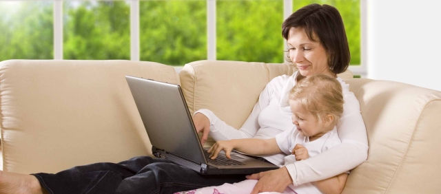 clipping path! mother with daughter on the sofa